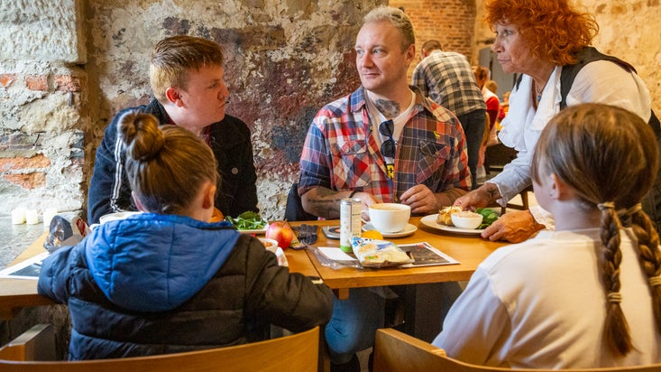 A family enjoys treats in the Brewhouse Cafe at Seaton Delaval Hall Northumberland